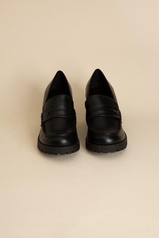 Shophouse Northwest black leather KINDER Loafer shoes front view with lug sole and penny strap on beige background