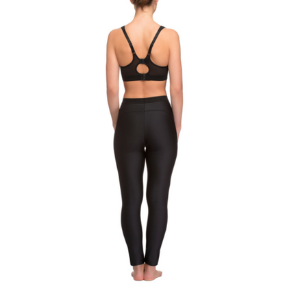 Back view of a model wearing Lauma active long leggings paired with a black sports bra