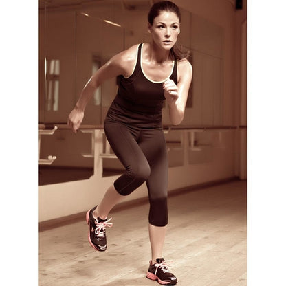 Woman running in Lauma Capri Active leggings with a sleek design and comfortable fit for workouts