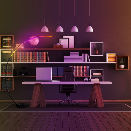 Modern curve floor lamp in a stylish home office with shelves and desk setup