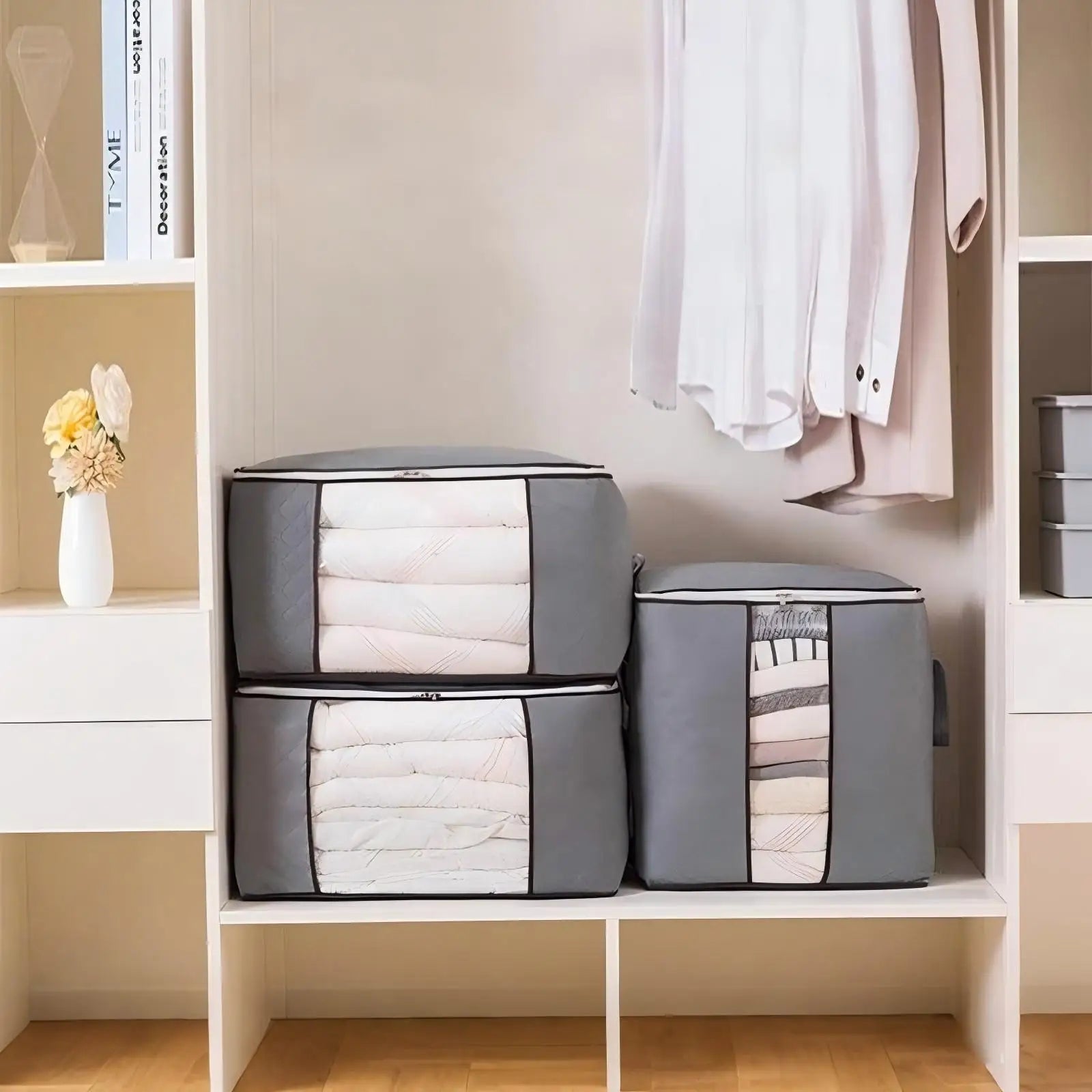 Moisture-proof blanket storage containers in grey neatly organizing bedding in a closet