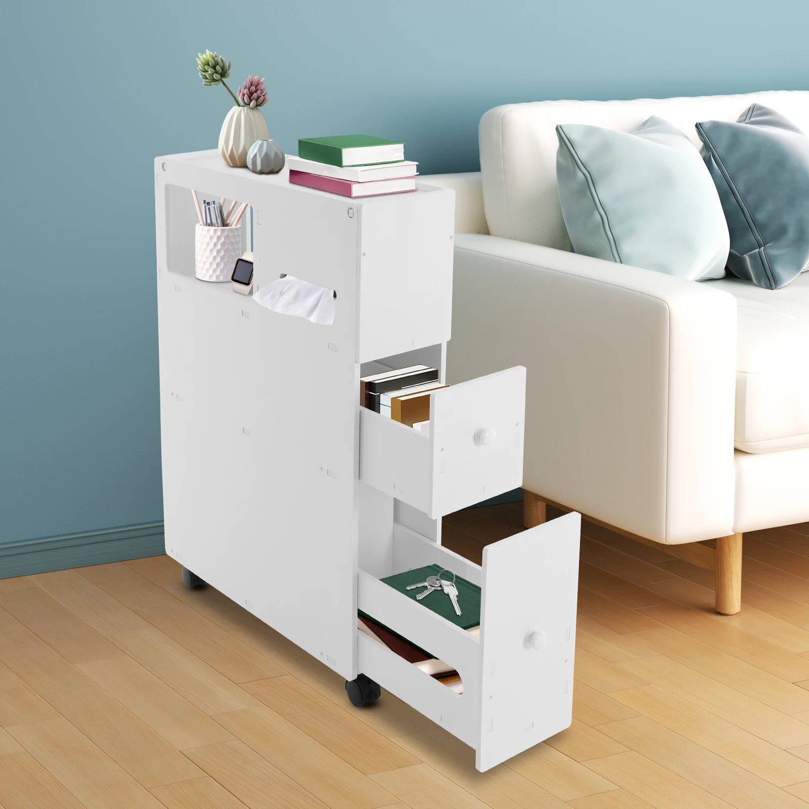 Narrow bathroom storage cabinet in white with multiple drawers and open shelves for organized storage