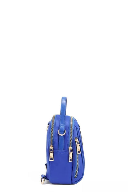 Nicole Lee color patch bag in vibrant blue with multiple zippers and a top handle