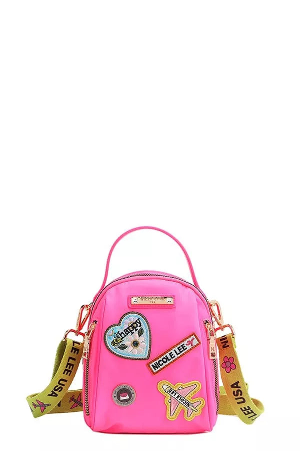 Nicole Lee color patch bag in vibrant pink with fun patches and adjustable strap
