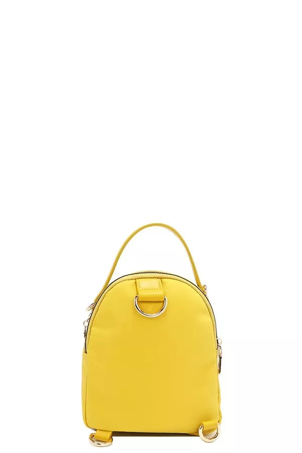 Nicole Lee color patch bag in vibrant yellow with stylish design and top handle for easy carry