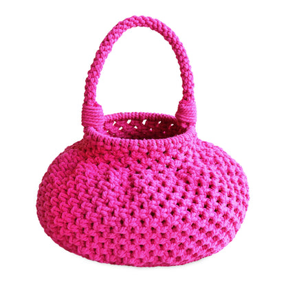 Pink macrame basket bag with a round design and sturdy handles for stylish storage