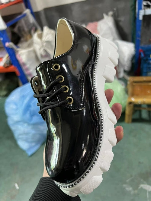 Shophouse Northwest platform oxford shoes for women in black with chunky white sole and lace-up design