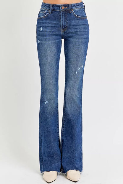 Trendsi plus size distressed flare jeans in dark wash with stylish rips and a flared leg fit