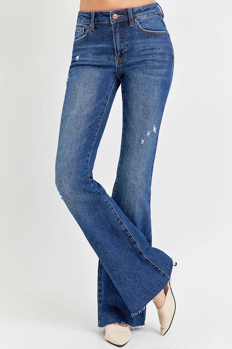 Plus size distressed flare jeans in denim blue with a stylish cut and trendy design