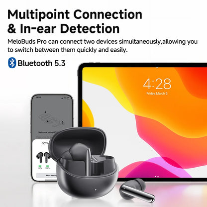 Shophouse Northwest QCY MeloBuds Pro ANC earbuds black with open charging case and one earbud beside phone and tablet