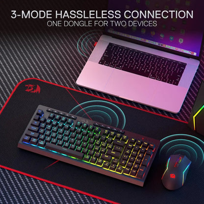 Shophouse Northwest Redragon wireless gaming keyboard and RGB mouse on large mouse pad next to laptop