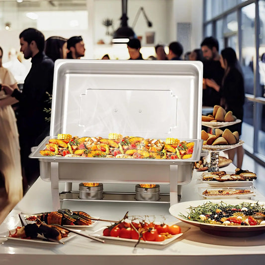 Stainless steel chafing dish buffet set displaying a variety of gourmet foods at a catering event