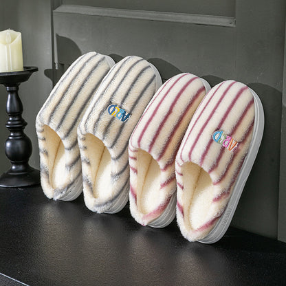 Striped plush winter slippers in various colors for cozy indoor comfort