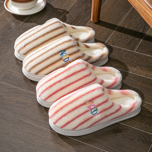 Striped plush winter slippers in soft colors for cozy indoor comfort and warmth