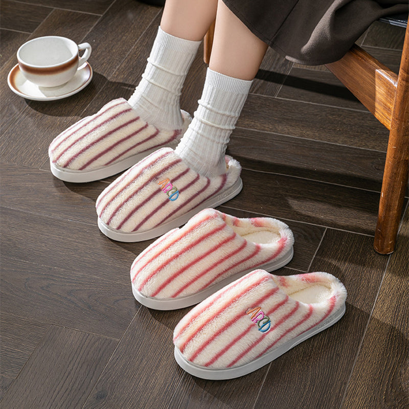 Striped plush winter slippers featuring soft lining for cozy comfort at home