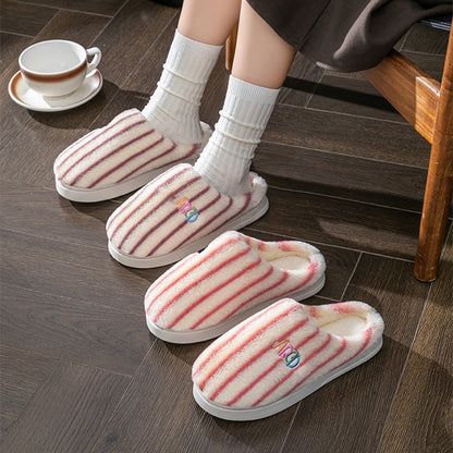 Striped plush winter slippers featuring soft lining for cozy comfort at home