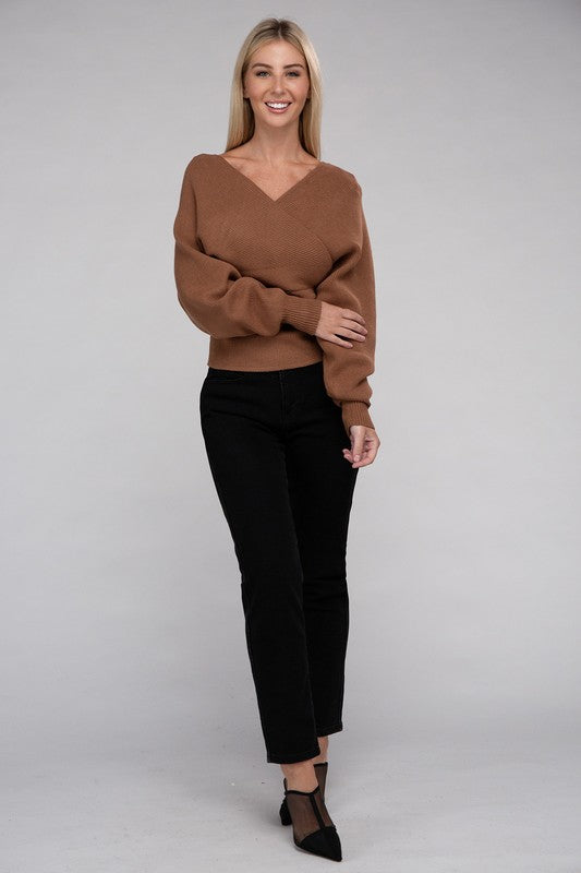 Shophouse Northwest brown viscose wrap sweater on smiling model with black pants and pointed heels