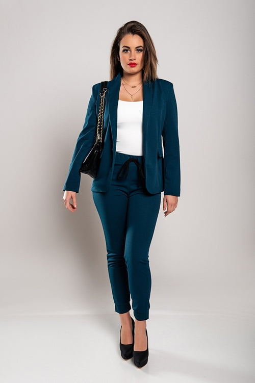 Stylish petrol blazer and trousers for women, paired with a white top and black heels
