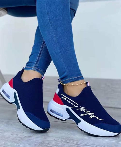 Stylish navy Tommy Hilfiger casual walking shoes for women with slip-on design and air cushioning