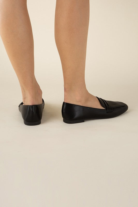Shophouse Northwest Harriet-8 slip on penny flats shoes black leather shown on model feet side and back view