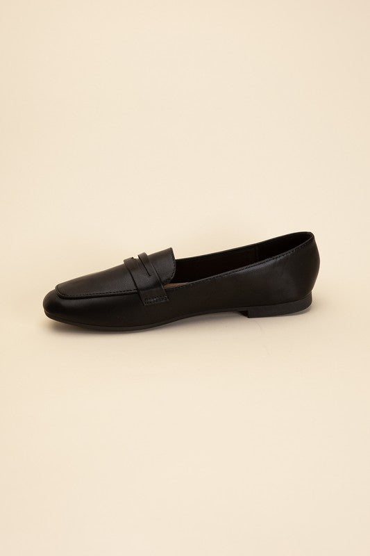 Shophouse Northwest Harriet-8 slip on penny flats shoes black leather penny loafer flat side profile on beige