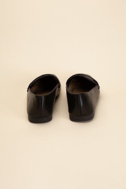 Shophouse Northwest Harriet-8 slip on penny flats shoes black leather back view on beige studio background