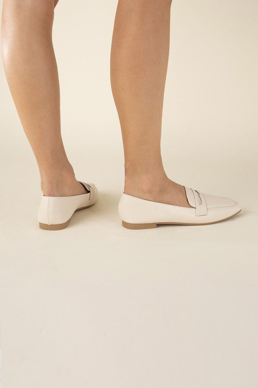 Shophouse Northwest Harriet-8 slip on penny flats shoes in cream leather worn on model legs