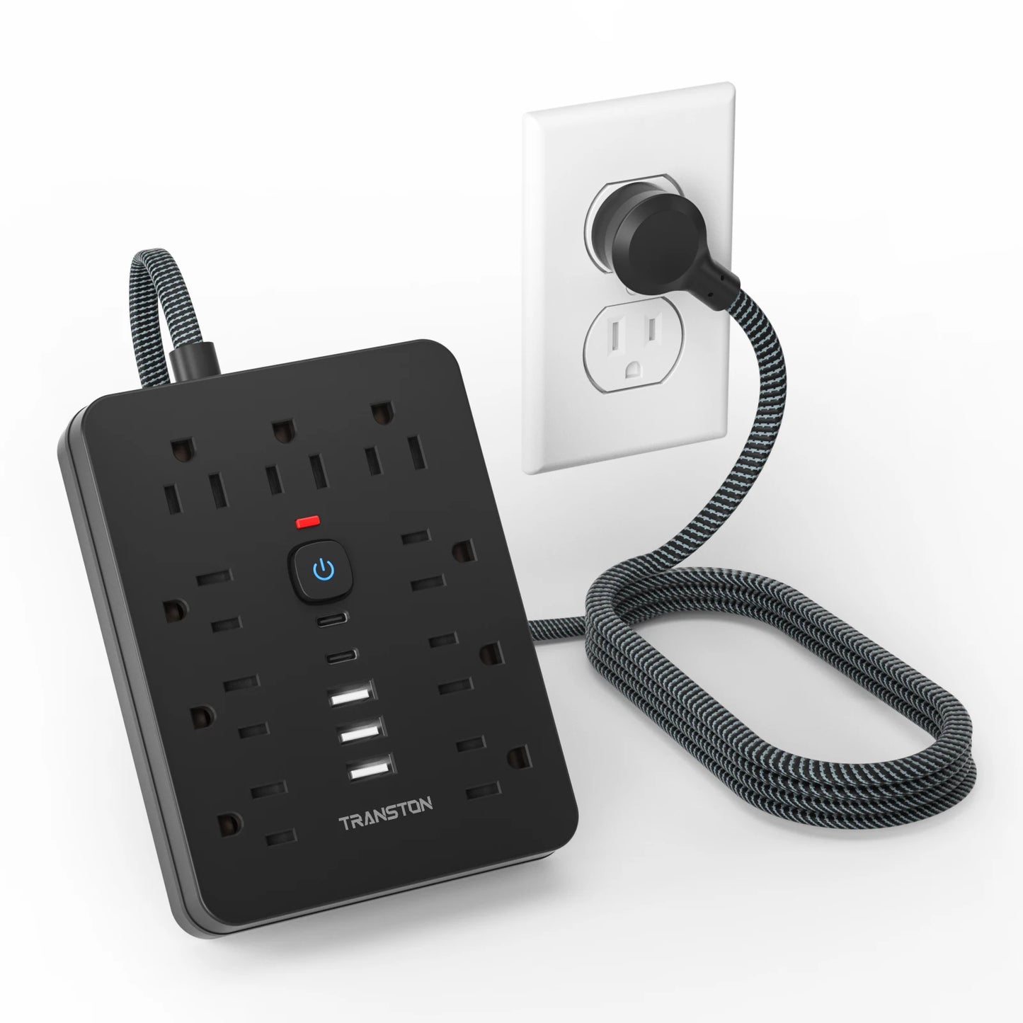 Black power strip surge protector with USB C featuring multiple outlets and a braided cord plugged into a wall socket
