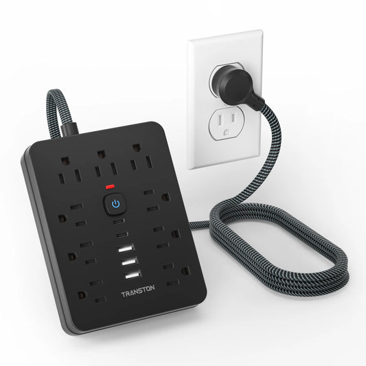 Black power strip surge protector with USB C featuring multiple outlets and a braided cord plugged into a wall socket
