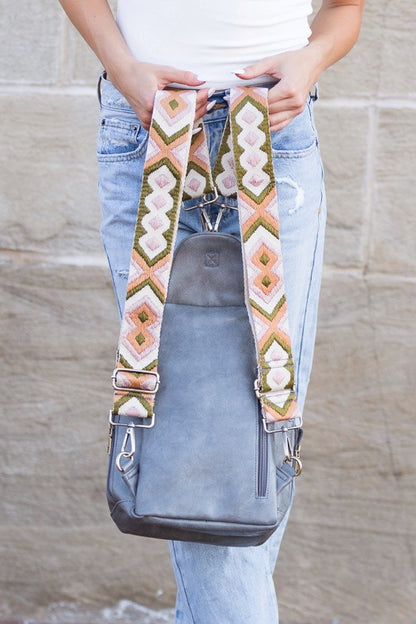 Alba backpack sling convertible bag gray leather crossbody with adjustable patterned straps shown worn