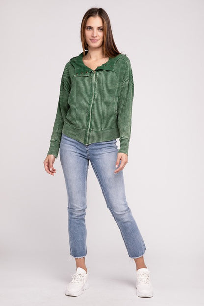 Shophouse Northwest acid wash waffle zip up jacket in green on model with hood light denim jeans