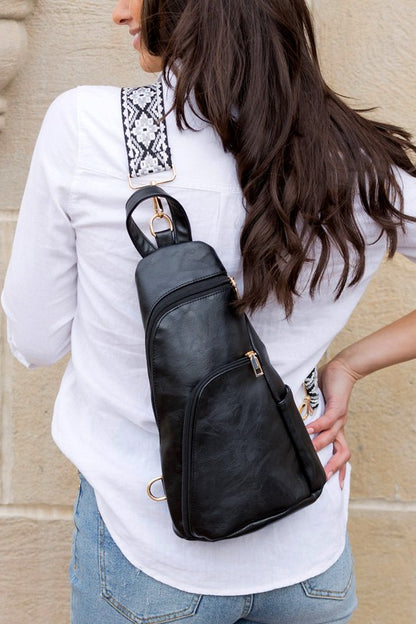Shophouse Northwest black leather everyday sling bag for women worn crossbody with patterned adjustable strap