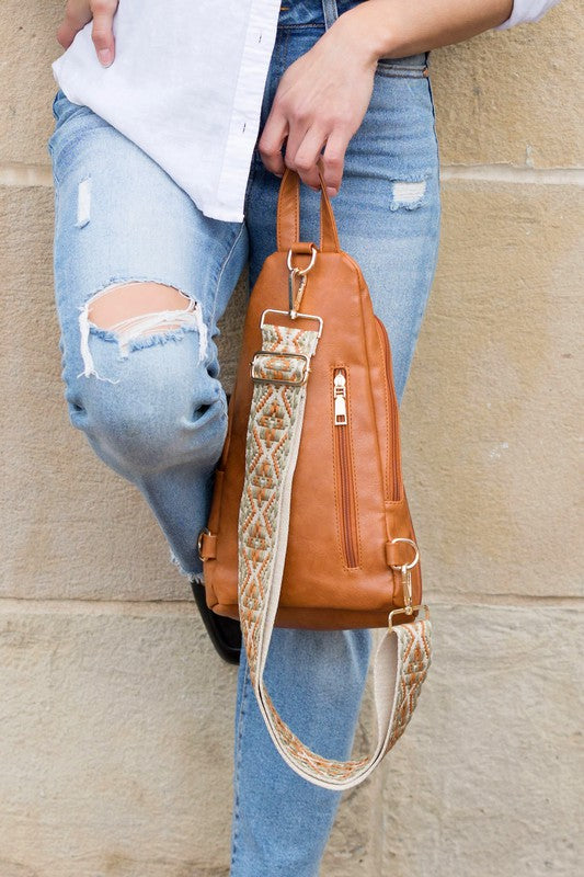 Shophouse Northwest tan leather everyday sling bag for women with patterned adjustable strap and gold zippers