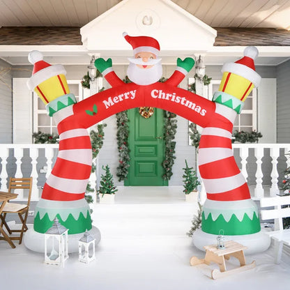 Colorful lighted Christmas inflatable archway featuring Santa and festive decorations