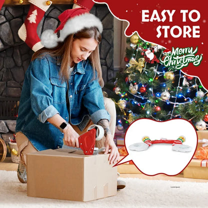 Woman unpacking a lighted Christmas inflatable archway for holiday decorations by Shophouse Northwest