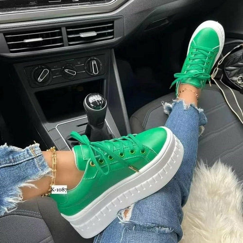Green women platform sneakers with a stylish design and comfortable sole for casual wear