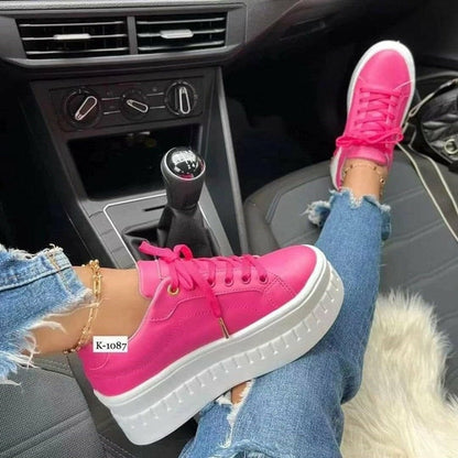 Bright pink women platform sneakers with a thick white sole, perfect for stylish casual outfits