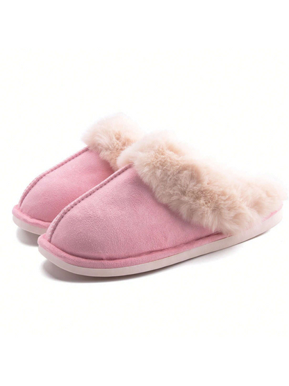 Pink slippers with fur trim on a white background